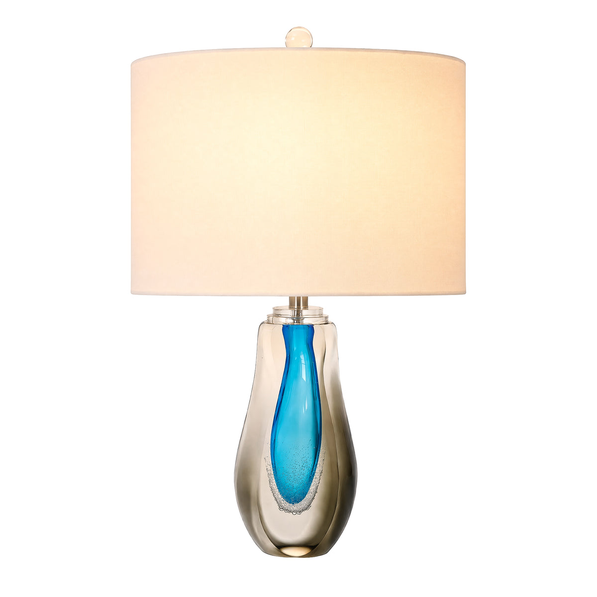 Illuminated art glass table lamp featuring a blue glass inner core with organic bubble textures