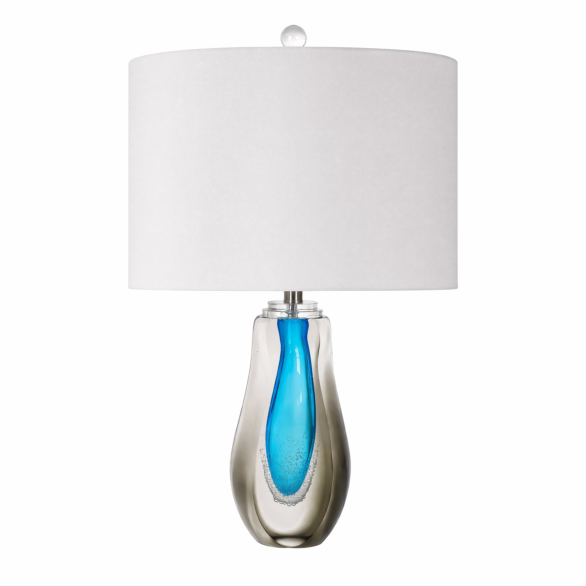 Art glass table lamp with clear smoke outer glass and vibrant blue teardrop inner core on a plain background