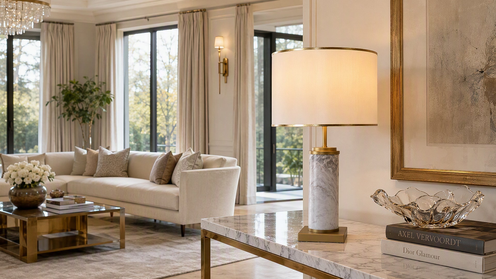 Illuminated white marble table lamp on marble console table in spacious bright living room