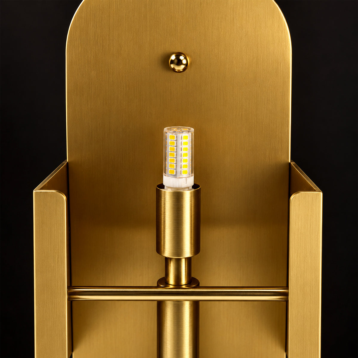 Close up view of internal brushed solid brass backplate frame and LED bulb structure of alabaster wall light