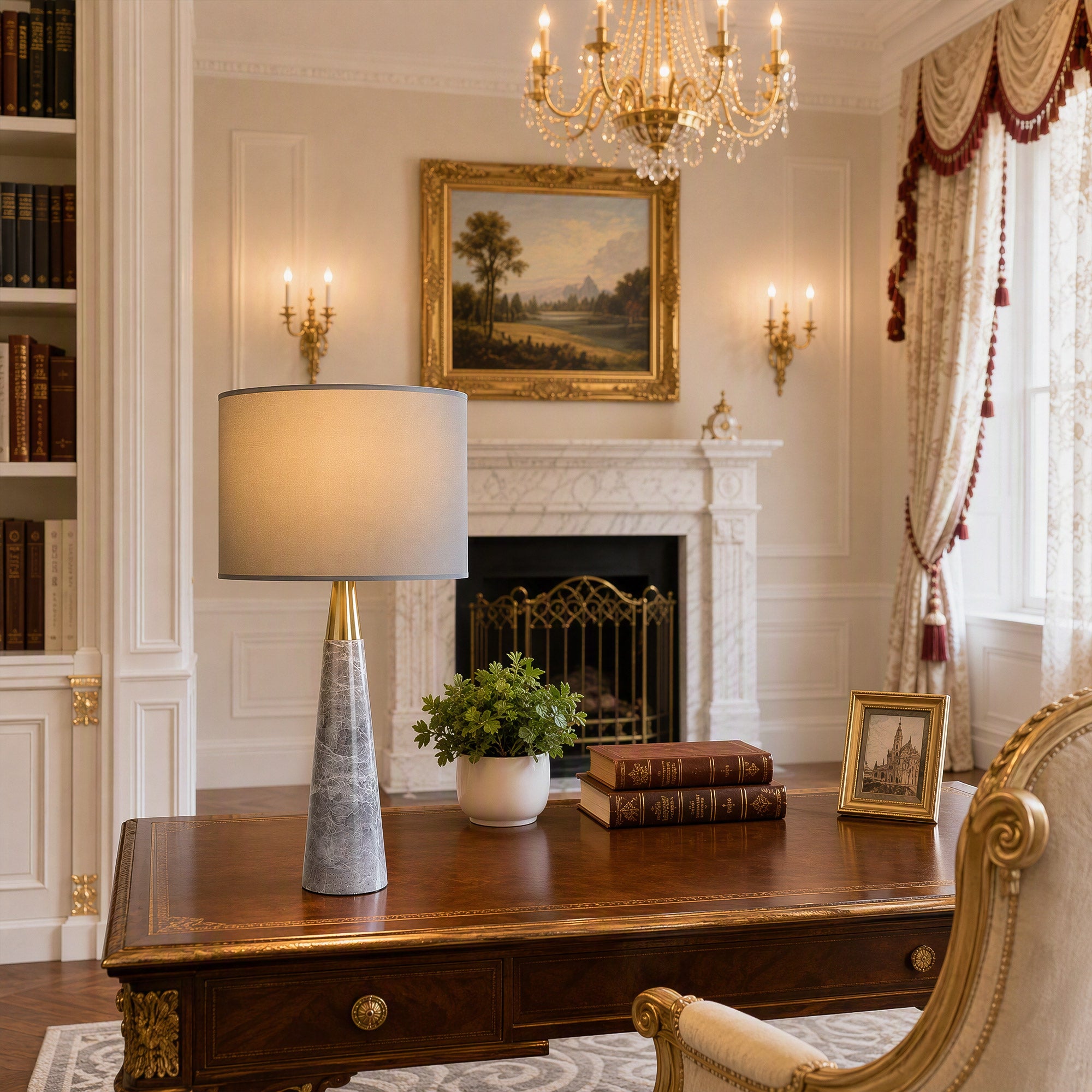 Illuminated grey marble table lamp on dark executive wooden desk in luxury classical study