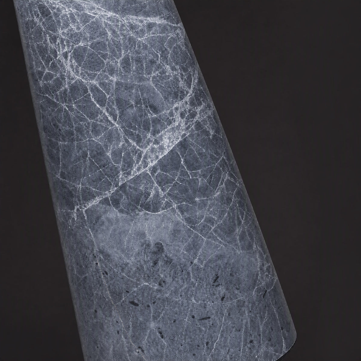 Extreme close up detail of grey natural marble base showing white intricate vein patterns