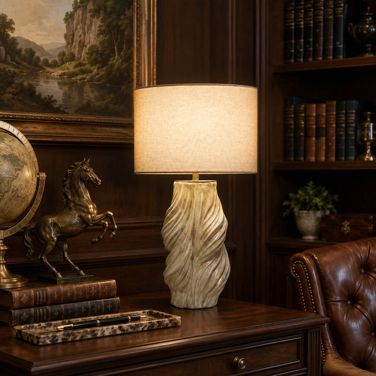 Vintage handmade twisted ceramic table lamp glowing on dark wooden executive desk in sophisticated classic study