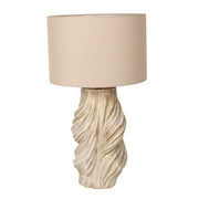 Handmade vintage twisted ceramic table lamp with beige fabric shade turned off on white background
