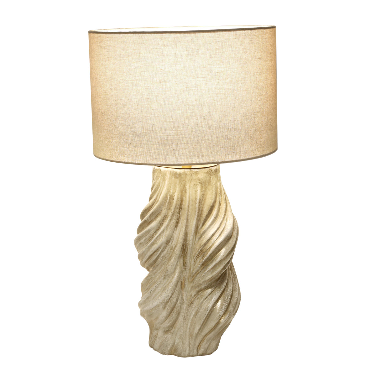 Warm illuminated handmade vintage twisted ceramic table lamp with beige fabric shade on white background