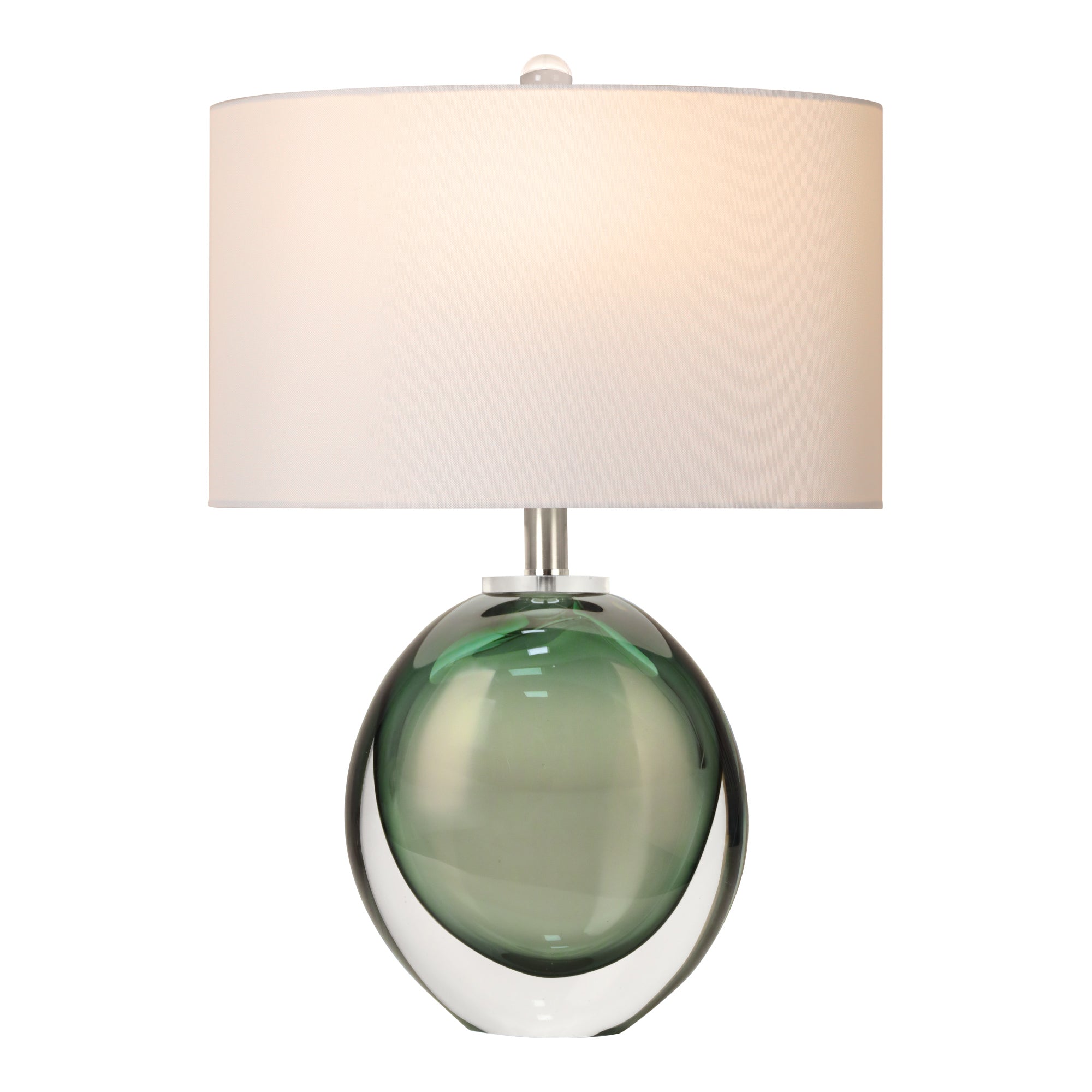 An illuminated emerald green seeded glass orb table lamp casting a warm ambient glow through its white fabric drum shade on a seamless white background
