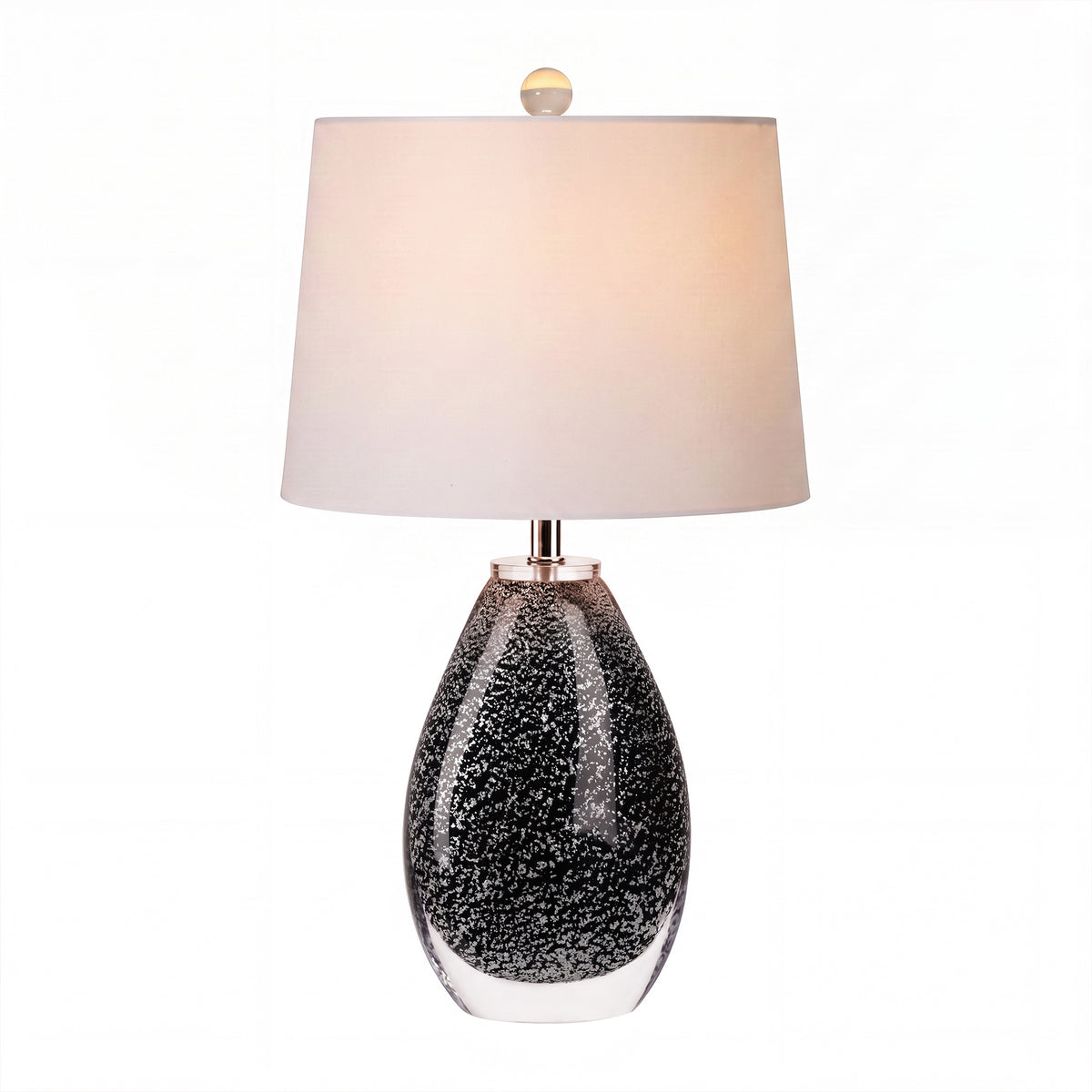 Illuminated Murano style teardrop black glass table lamp emitting warm glow on white background.