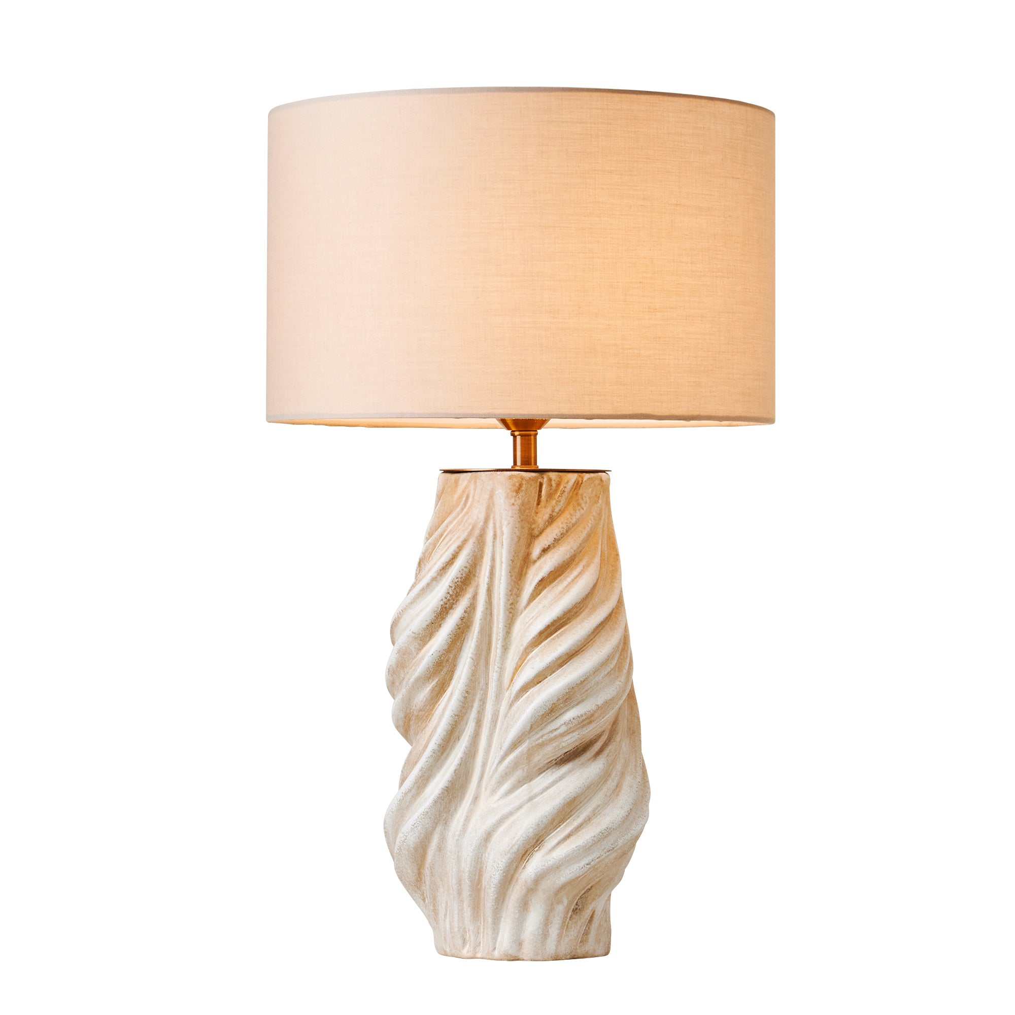 An illuminated spiral fluted ceramic bedside lamp casting a warm glow through its linen shade on a seamless white background