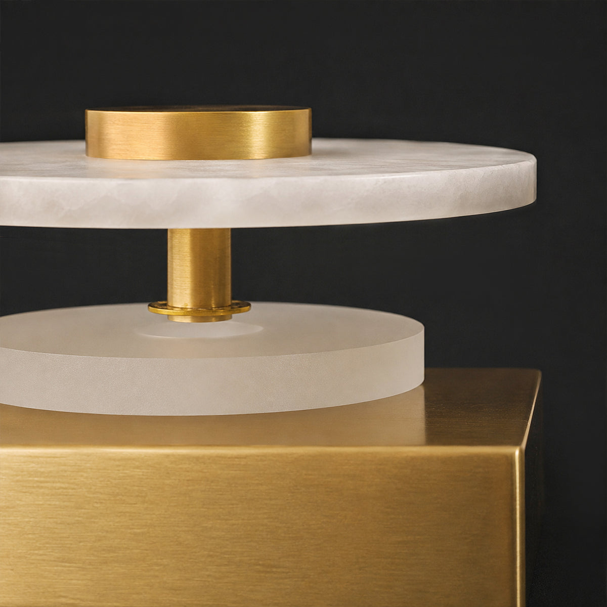 Close up of solid brushed brass hardware base and translucent Spanish alabaster stone layer detail