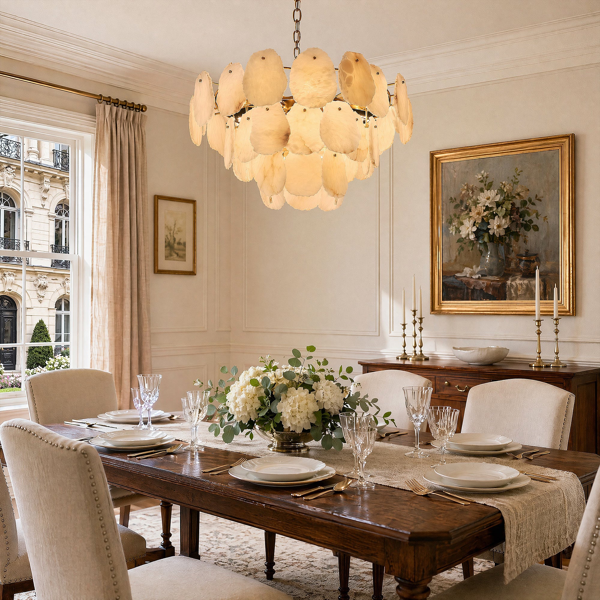 A formal dining room setup with an upholstered chair set around a wooden table, illuminated by a sculptural Spanish alabaster stone chandelier in soft afternoon light.