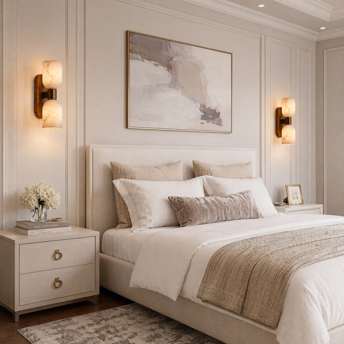 A high-end organic modern bedroom featuring a pair of goblet-shaped alabaster wall sconces symmetrically flanking a tufted bed headboard and white nightstands under natural daylight.