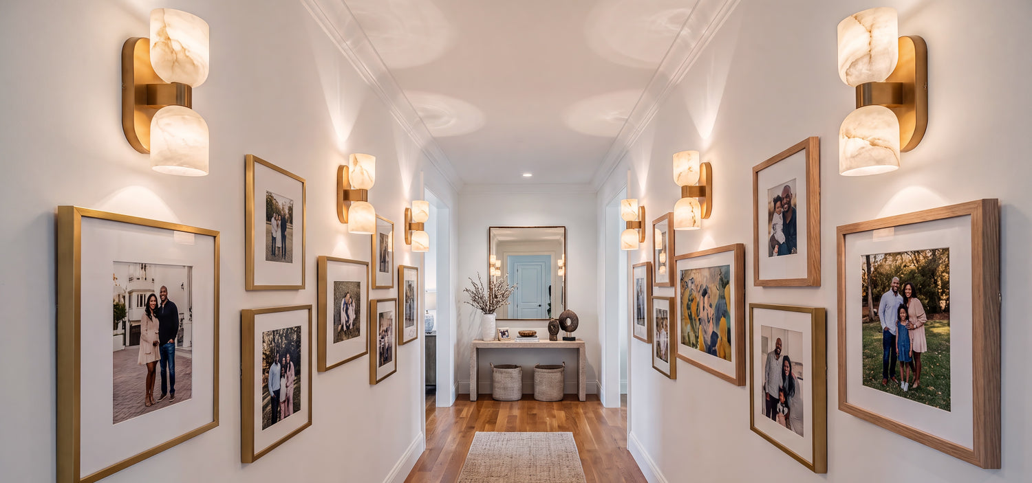 A gallery-inspired luxury hallway wall featuring high-end custom alabaster sconces with brass accents under bright natural daylight.