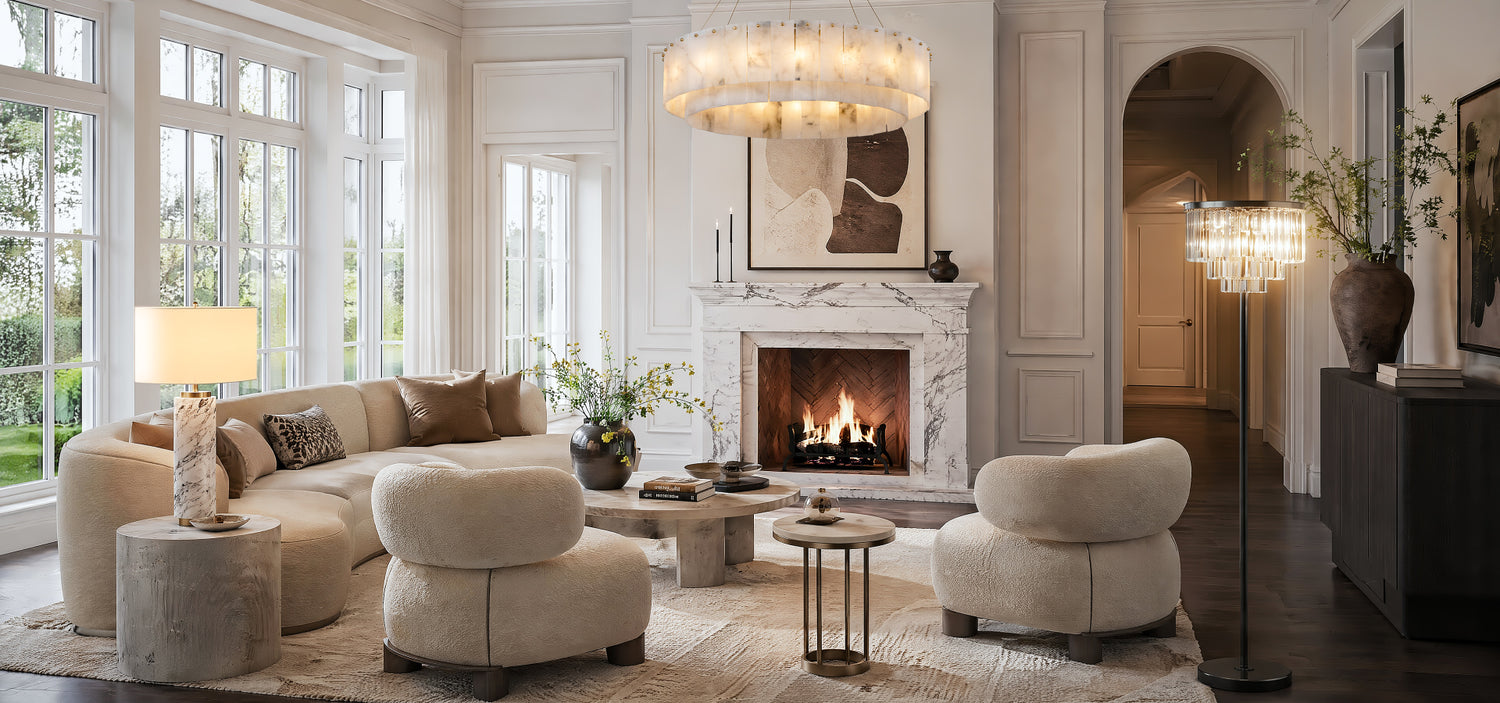 bright, sunlit quiet luxury living room featuring a sculptural natural alabaster chandelier, a heavy marble table lamp, and a minimalist iron floor lamp in soft daylight.