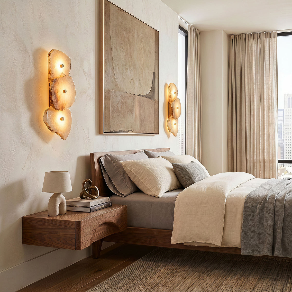 A high-end mid-century modern bedroom featuring a pair of warm alabaster wall lights on a textured plaster wall above floating wooden nightstands.