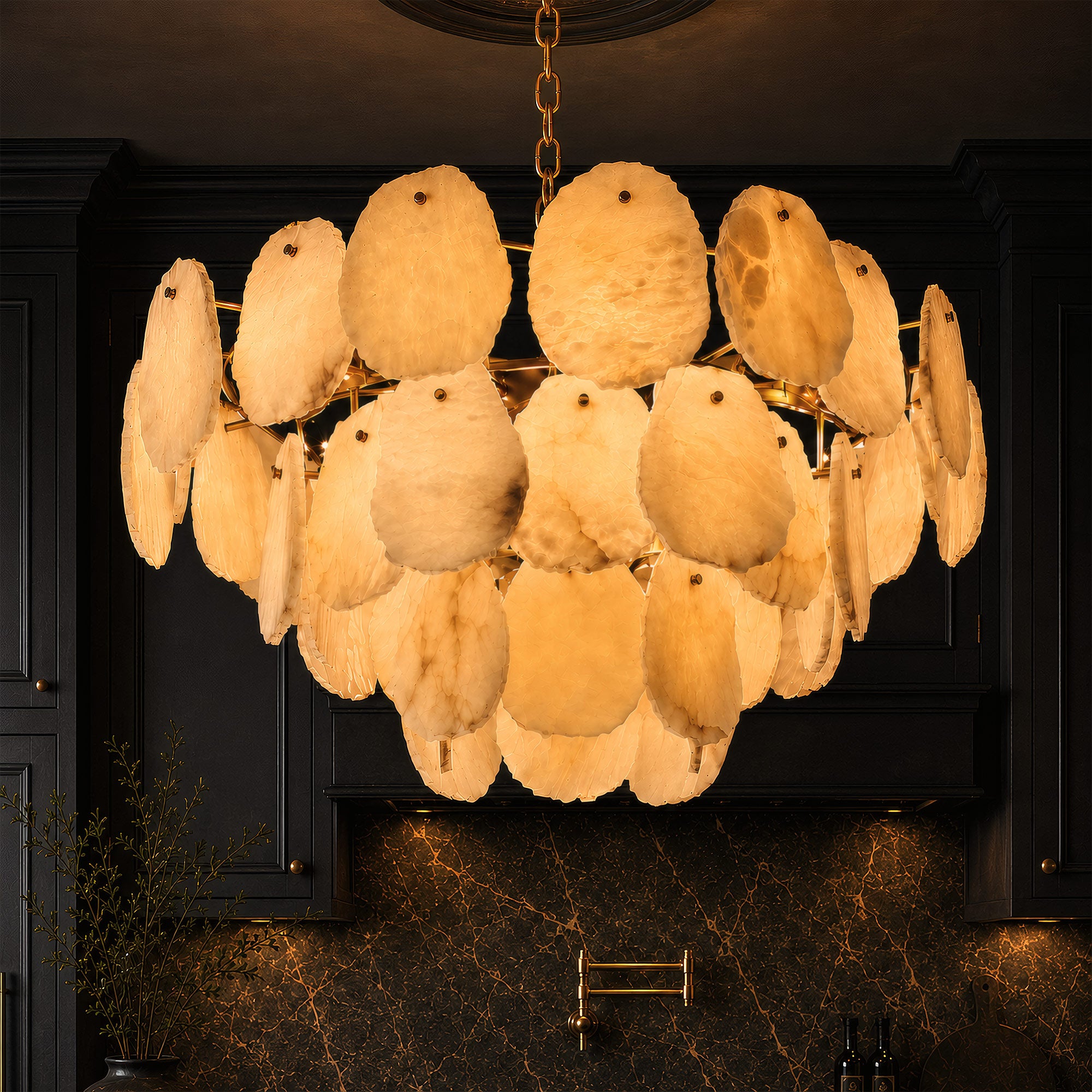 A close-up view of a glowing natural alabaster rock chandelier hanging against a dark charcoal kitchen cabinet background with marble slab details.