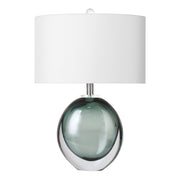 Murano style moss green bubble art glass table lamp with a thick clear outer layer and white drum shade turned off against a white background
