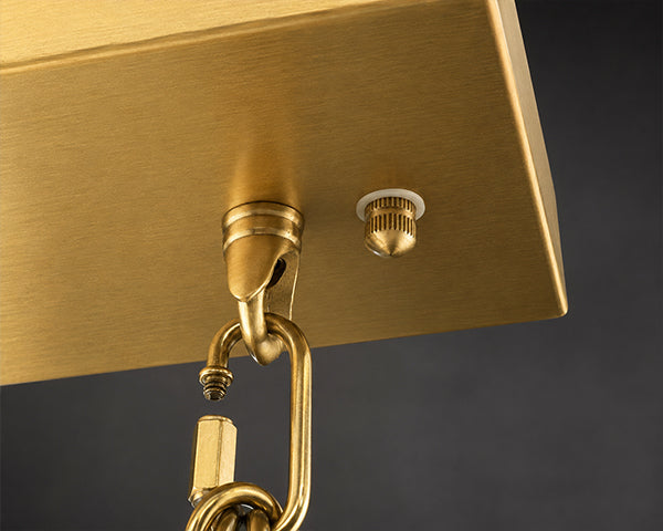 Close up of premium solid gold plated anti rust hardware featuring a brushed metal finish and heavy duty chain for a luxury chandelier fixture.