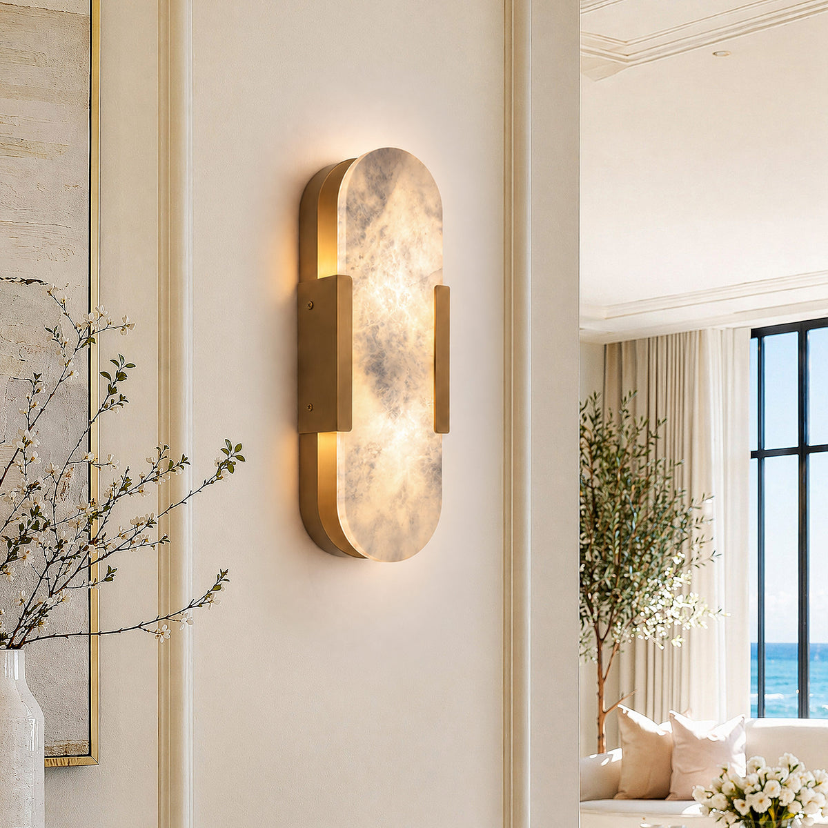 Glowing oval capsule Spanish natural alabaster wall light mounted on beige hallway wall in an elegant home interior