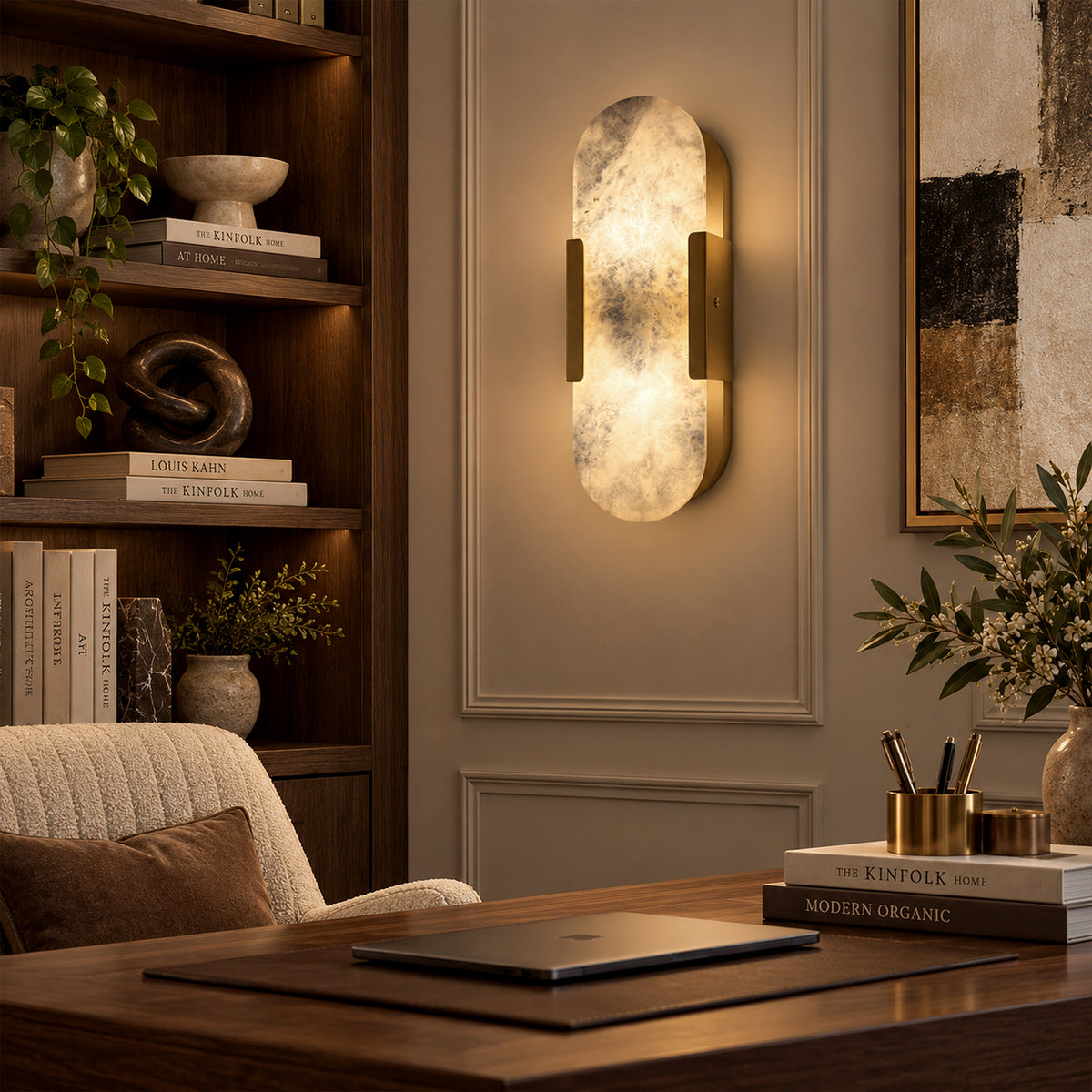 Illuminated oval Spanish natural alabaster wall sconce mounted on framed wall near wooden bookshelf in reading area
