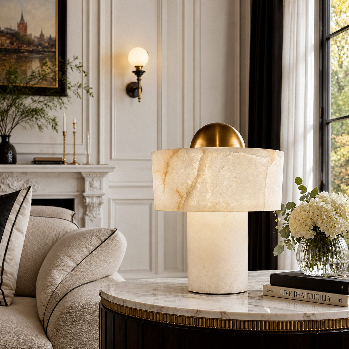 Close up of glowing Spanish alabaster table lamp on marble top side table beside sofa