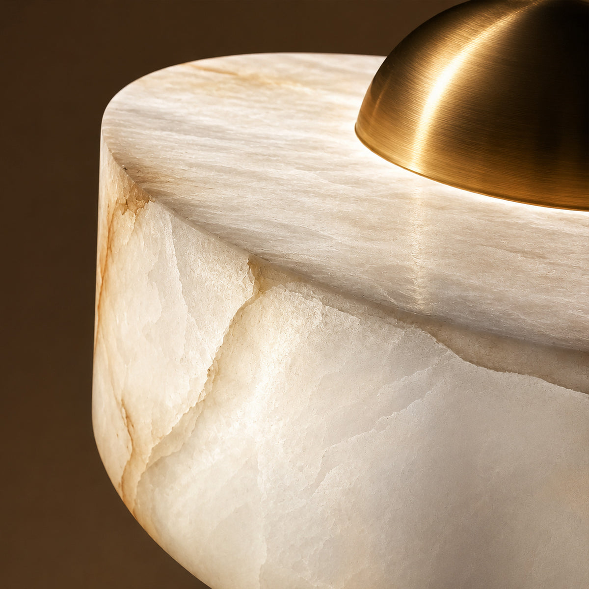 Close up of illuminated Spanish alabaster translucent texture and brushed brass dome accent