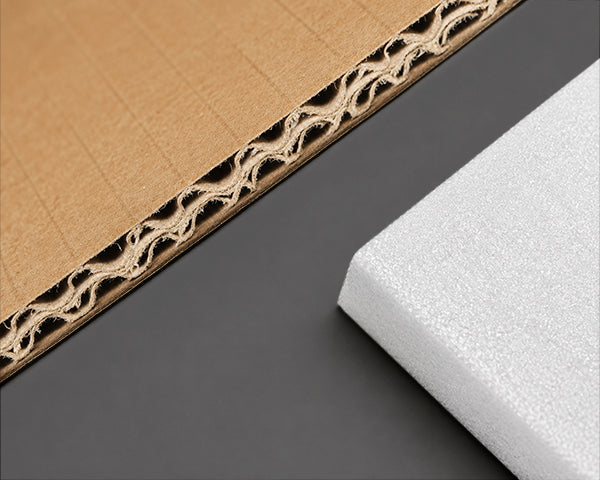 Detailed view of thickened shockproof packaging materials including multi layer corrugated cardboard and dense white foam designed to securely protect high quality light fixtures during transit.