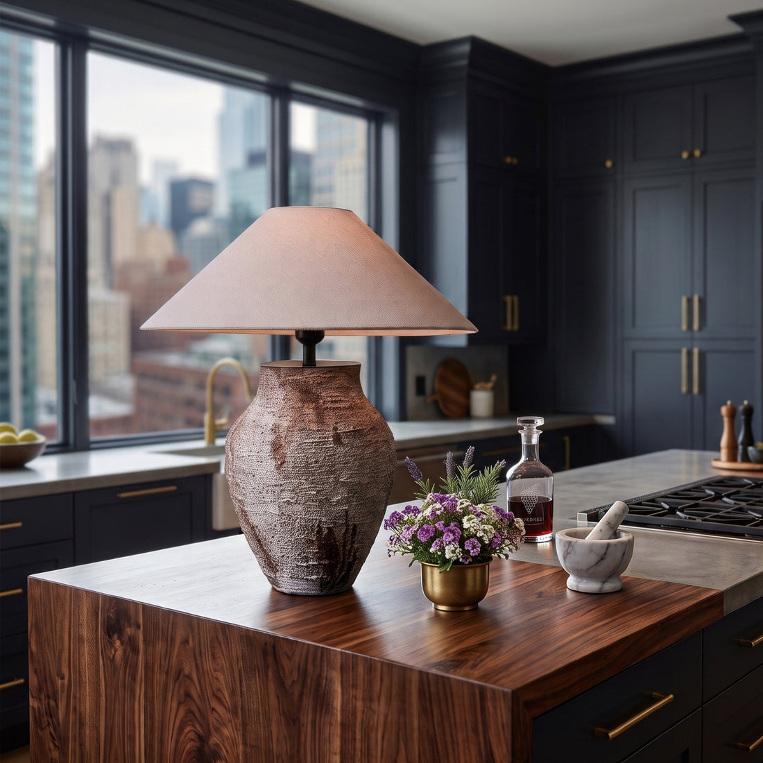 Vintage white textured ceramic table lamp placed on a rich wooden kitchen island counter near big window.